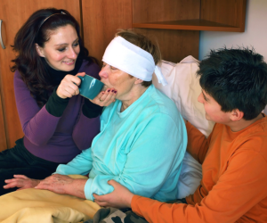 caregivers taking care of an elderly